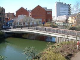 View over a footbridge in the middle of a town.